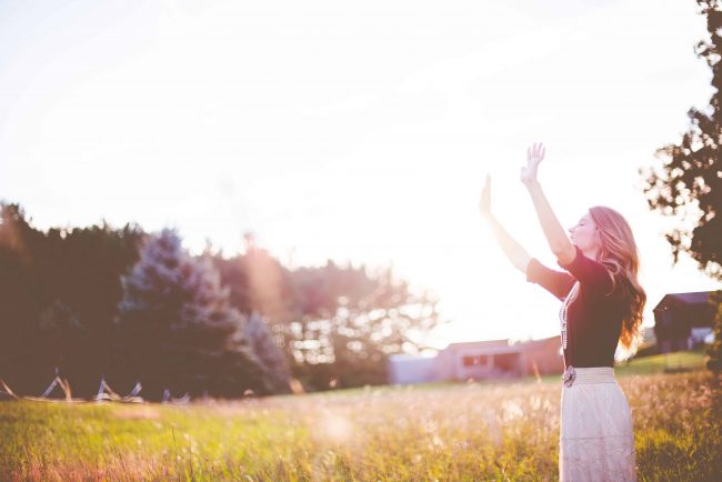 Woman with raised hands