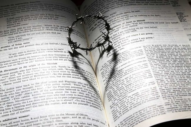 Heart shadow on open Bible