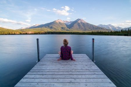 woman sitting on dock