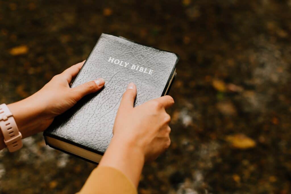 hands holding Bible