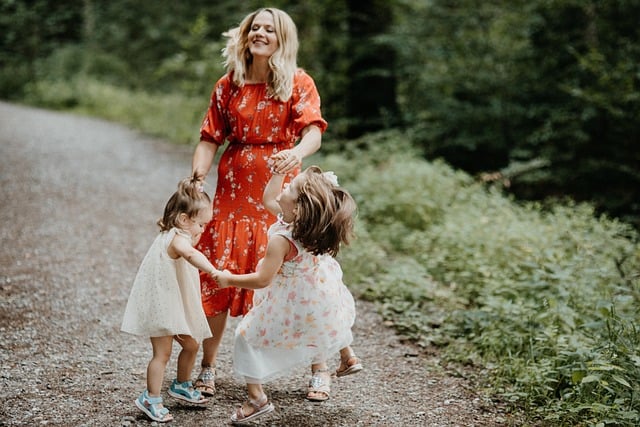 Woman dancing with two children