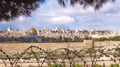 Jerusalem cityscape with barbed wire in foreground