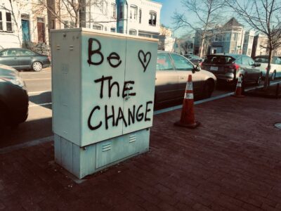 "Be the Change" graffiti on electrical box